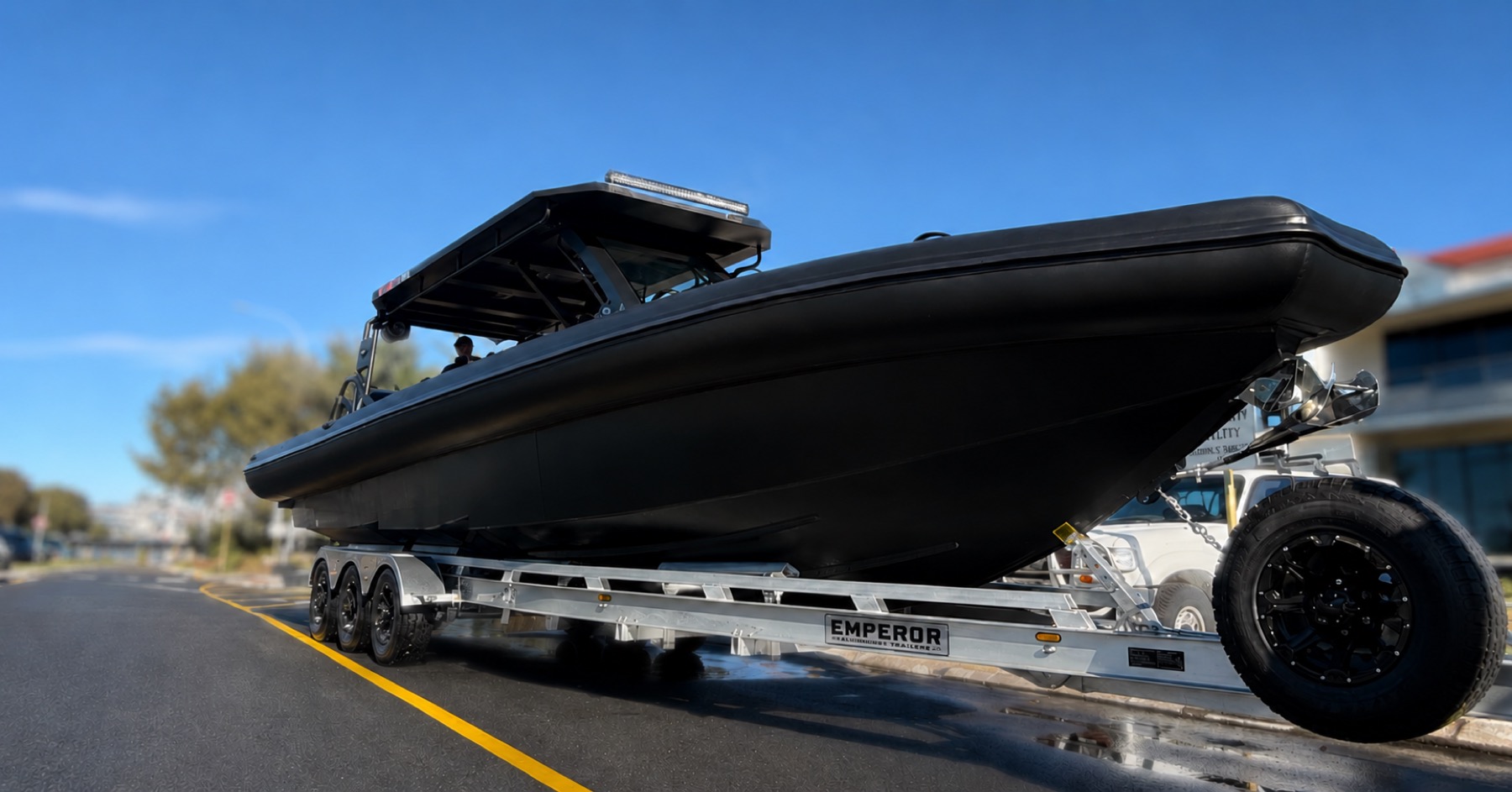 Emperor aluminium boat trailer loaded with a boat, background blurred